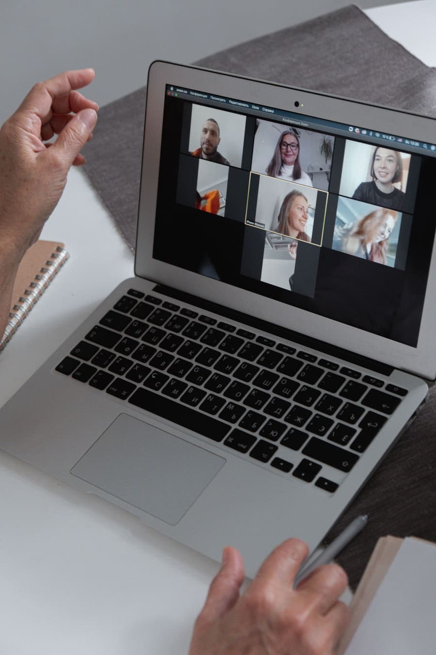 Professional joining a client video call from a laptop
